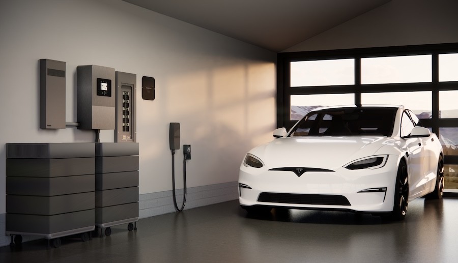 An electric car is being charged in the garage with Savant power.