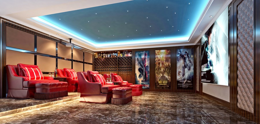 a home theater system with a projector and red recliners