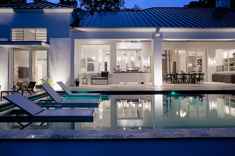 The exterior of a luxury home featuring Lutron smart lights.