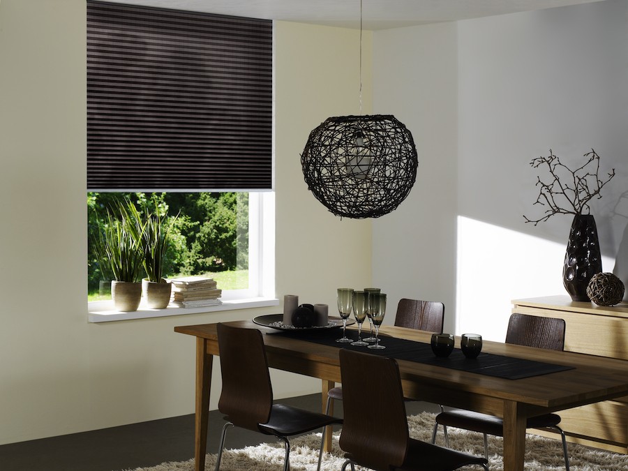 A dining room featuring QMotion shades.