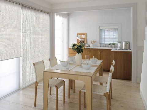 A beautiful dining area with QMotion shades.