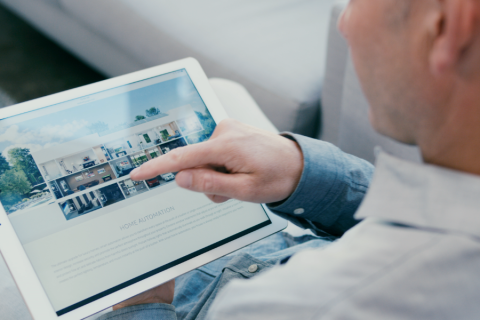 A person holding a tablet.