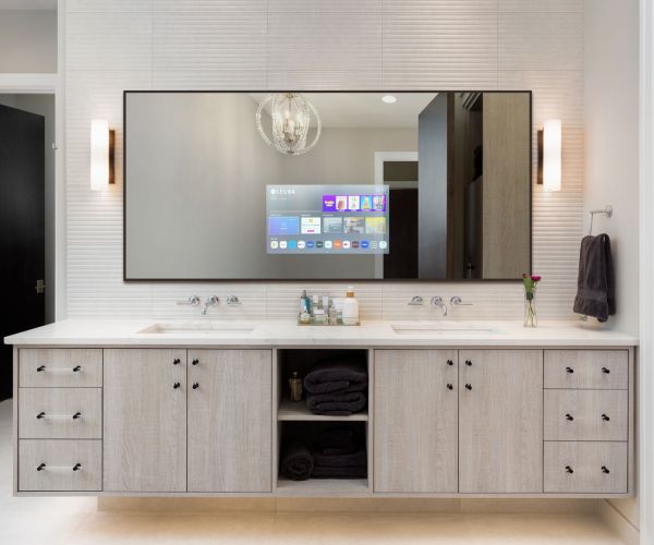 Dining room with three large windows featuring beige roller shades